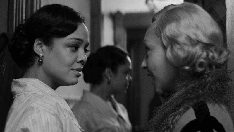lesbian movies 2021 list still: Tessa Thompson looks at Ruth Negga, her reflection in the mirror behind them.