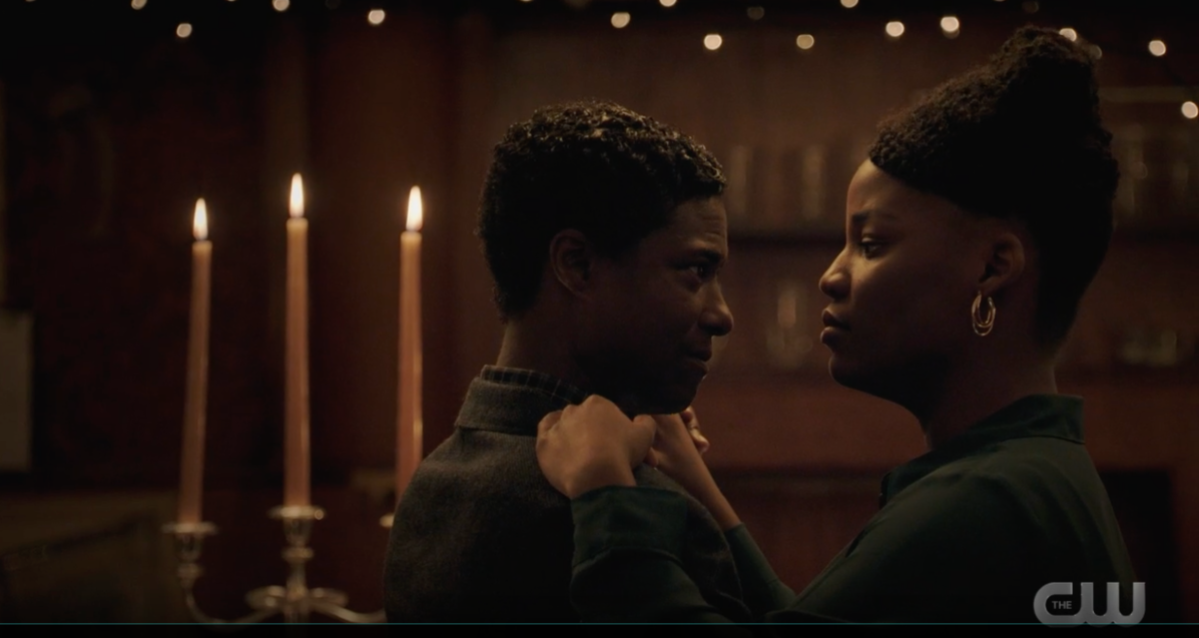 Doc and Shanice dance in a candlit abandoned bar made to reflect the 1920s