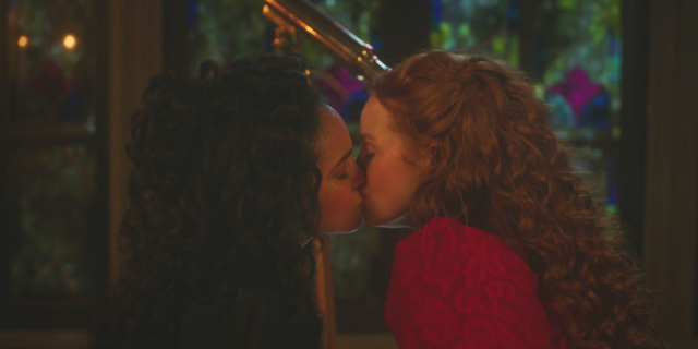 A photo of Thomasina Topaz and Abigail Blossom kissing in front of a telescope in 1892 in the Riverdale Sabrina crossover episode