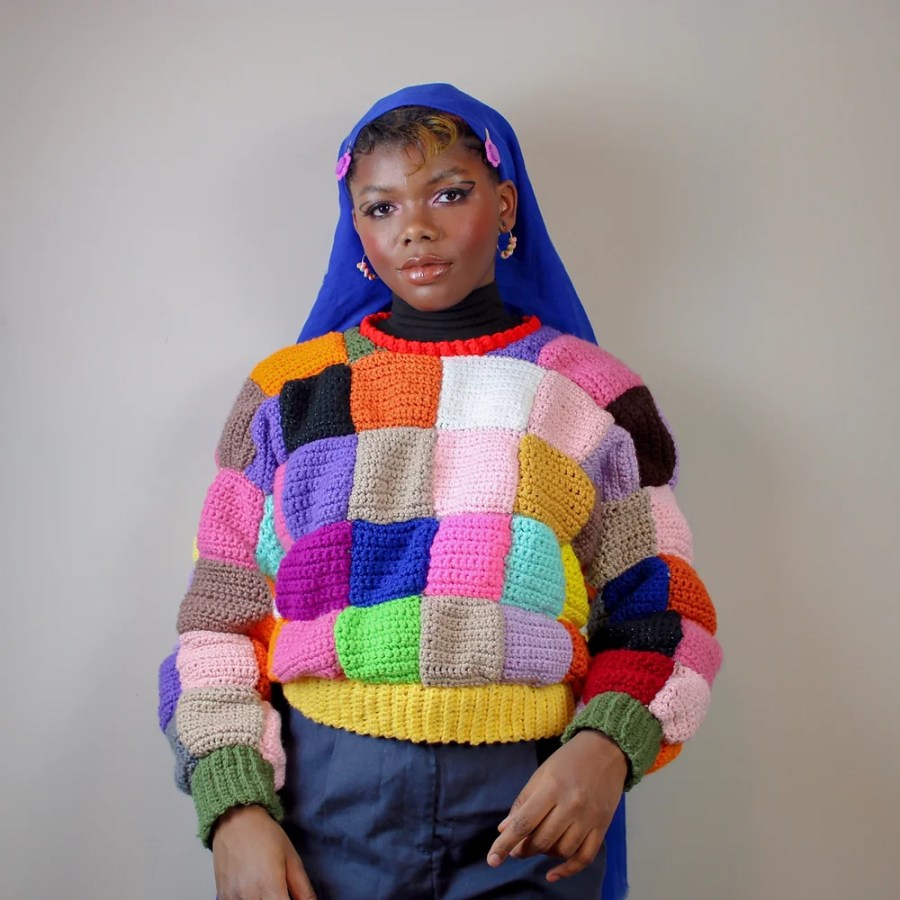 Model in patchwork sweater