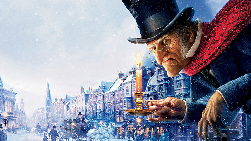 Scrooge holding a candle in A Christmas Carol