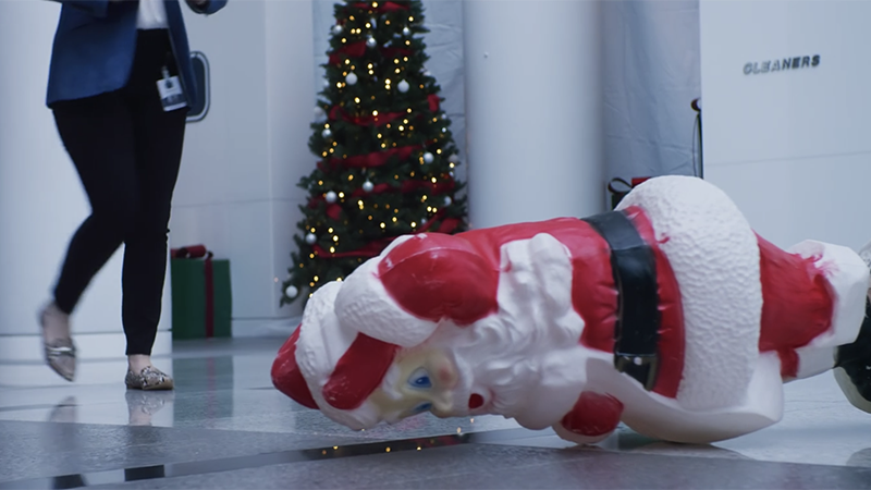 Santa lays face down on the floor