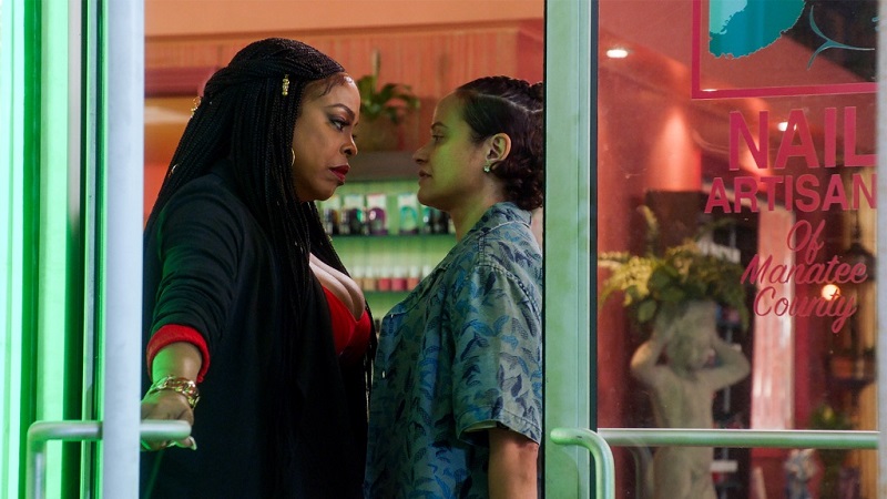 Desna and Ann stare each other down at the door to the Nail Artisans salon.