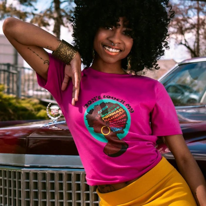 model in a "don't touch my hair" graphic tee
