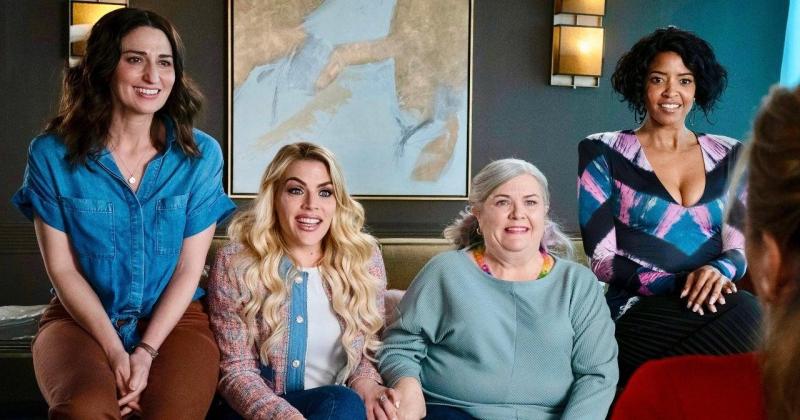 the girls on the couch excited in a still from Girls5Eva