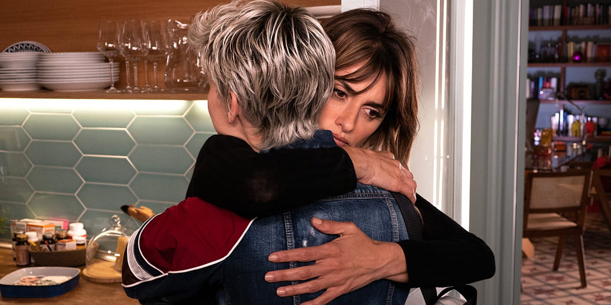 Penélope Cruz hugs a woman with short dyed blonde hair in Parallel Mothers