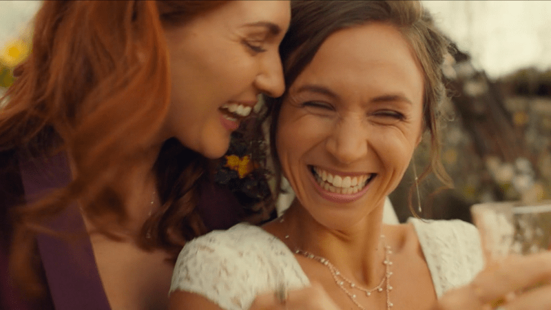 Waverly and Nicole smile on their wedding day
