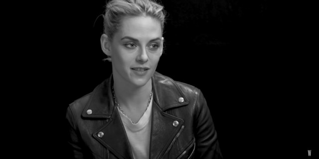 Kristen Stewart in a motorcycle jacket with blonde hair swept into a ponytail