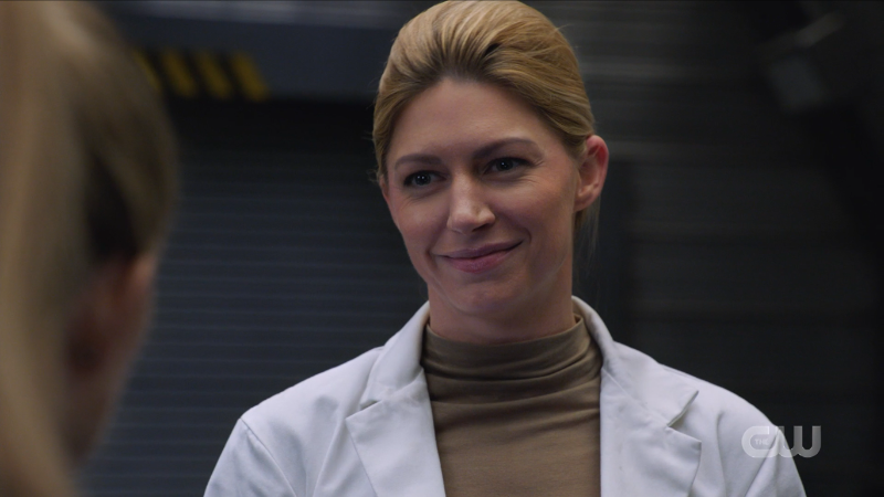 Dr. Sharpe smiles a smile that doesn't reach her eyes
