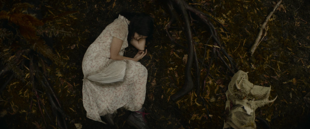 A screenshot from the Yellowjackets finale of Lottie in the woods