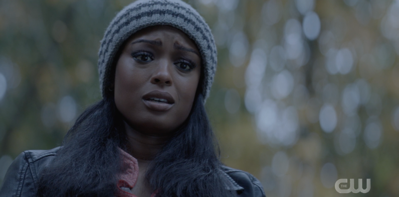 Ryan Wilder looking forlornly at her mom's grave