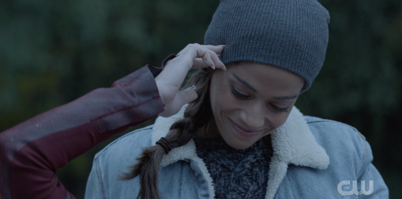 Renee smiling down at Pam as Pam caresses Renee's head