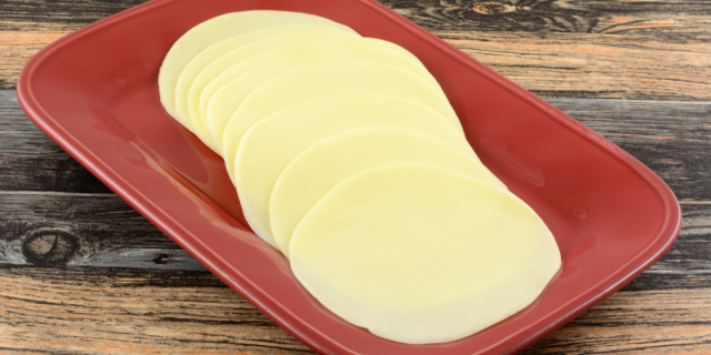 sliced provolone cheese on a plate