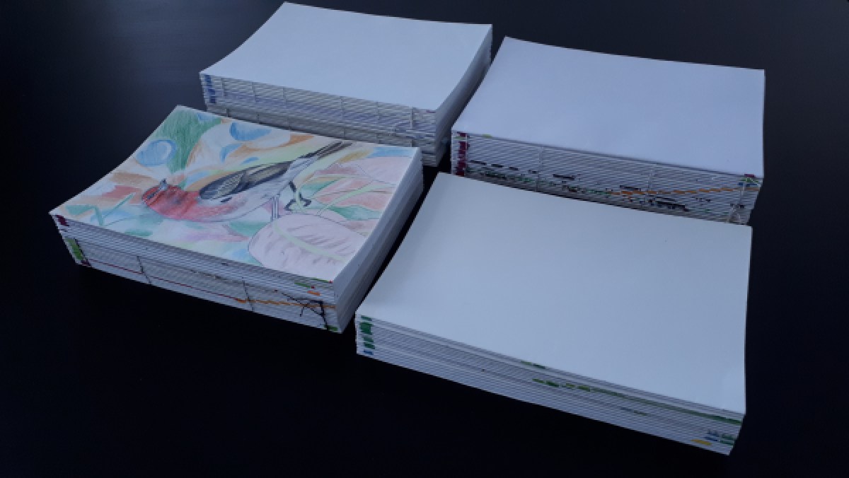 These are four stacks of paper, four books that have not yet been bound.