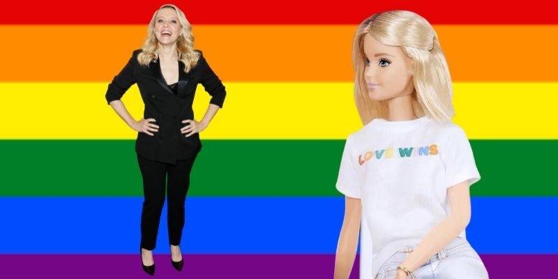 cut outs of Kate McKinnon, in a black suit, and a blonde Barbie doll, in a Love Wins shirt, in front of a rainbow flag