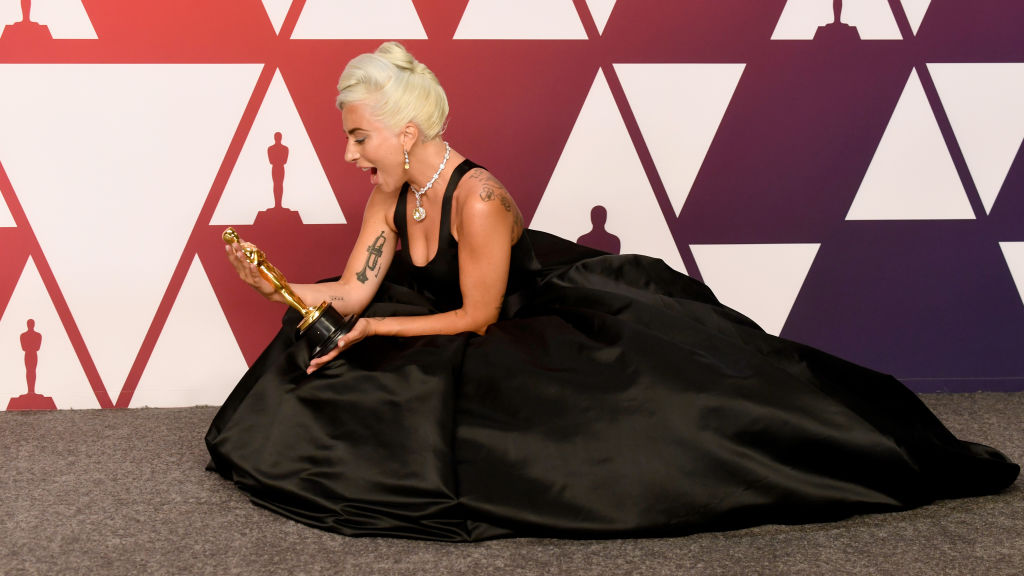 Lady Gaga clutching her Oscar