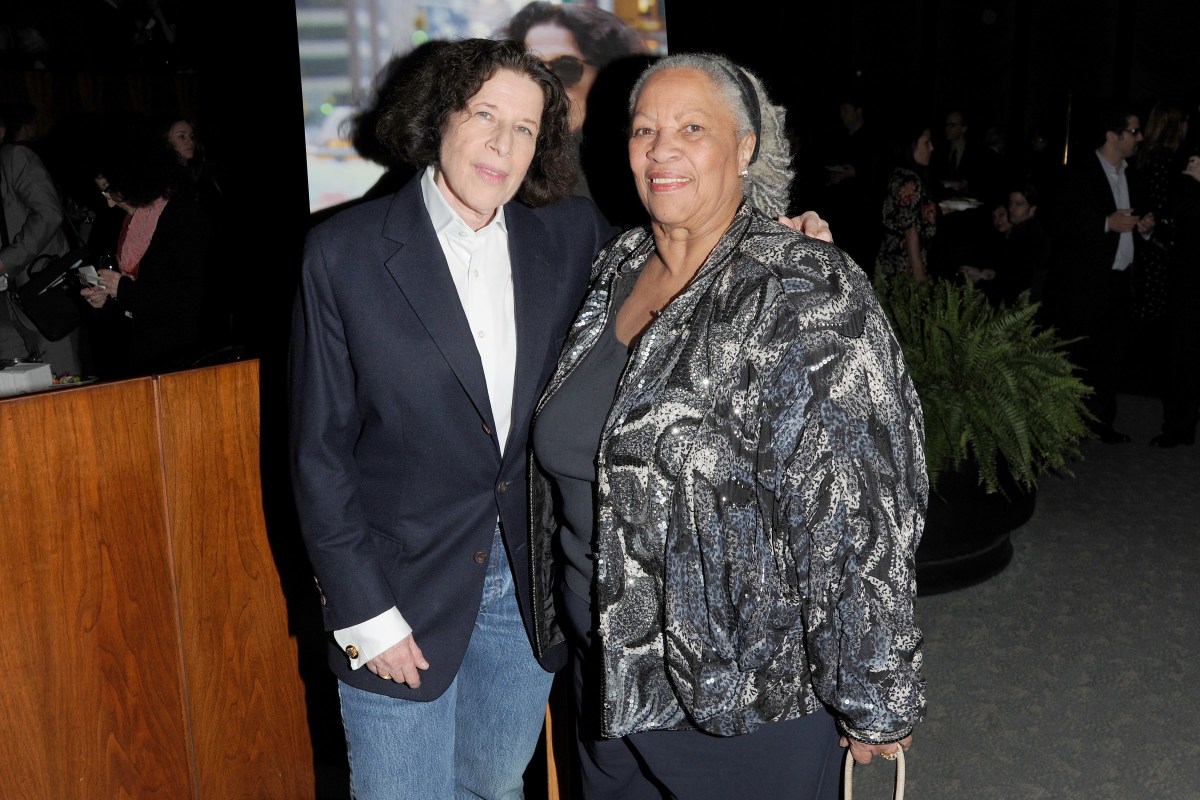 Fran Lebowitz and Toni Morrison attend The HBO Documentary Films Premiere of PUBLIC SPEAKING - After Party at Four Seasons Restaurant on November 15, 2010 in New York City. Fran is in a navy blue sports coat, her arm is around Toni Morrison in a grey coat with a grey pattern.