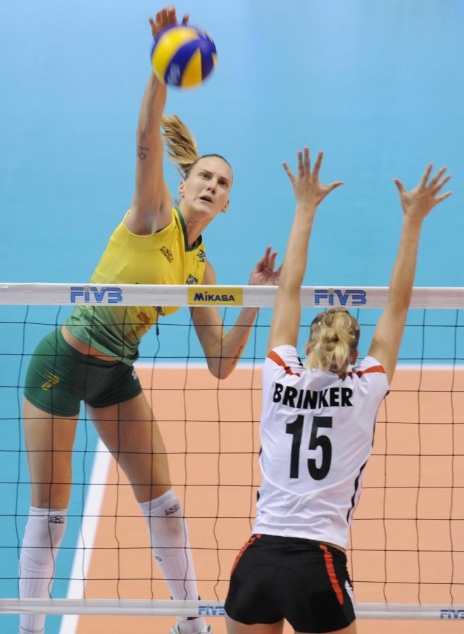 Brazil's Marianne Steinbrecher (L) spikes the ball over Germany's Maren Brinker (R) during their match at the World Grand Prix women's volleyball tournament final round in Tokyo on August 21, 2009. Brazil beat Germany 3-0 (25-15, 25-15, 25-16). AFP PHOTO/Kazuhiro NOGI (Photo credit should read KAZUHIRO NOGI/AFP via Getty Images)