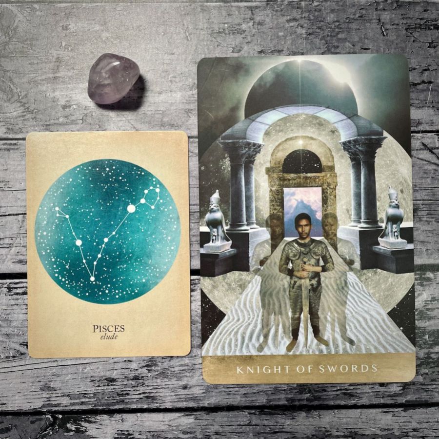 A card says Pisces: elude with an aqua blue circle, next to a card that says knight of swords with an illustration of young person in a knight’s universe holding a knife in a gallery with statues 