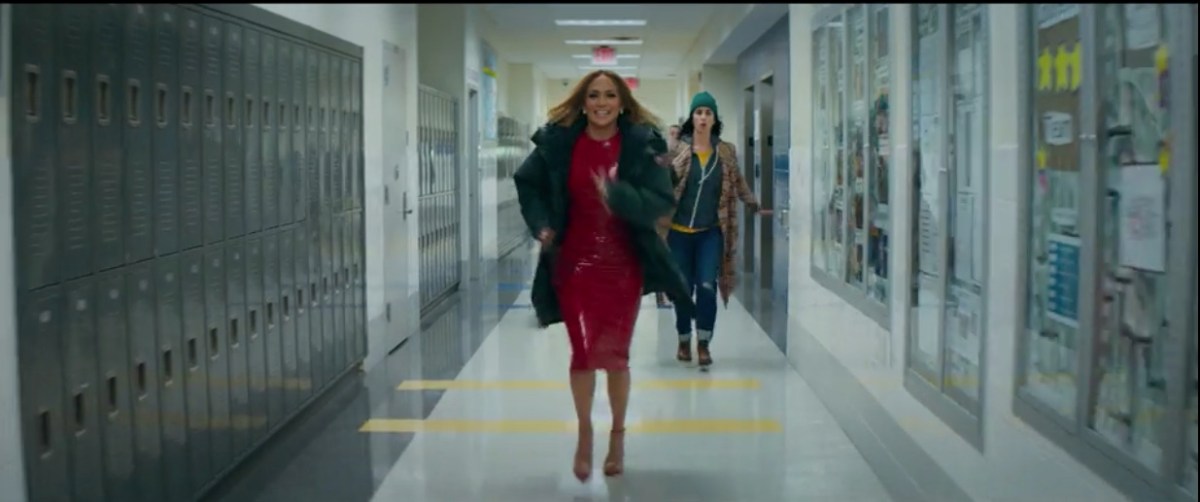 J-Lo running in heels with Parker behind her