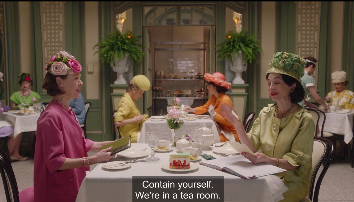 Rose at lunch surrounded by women in large hats