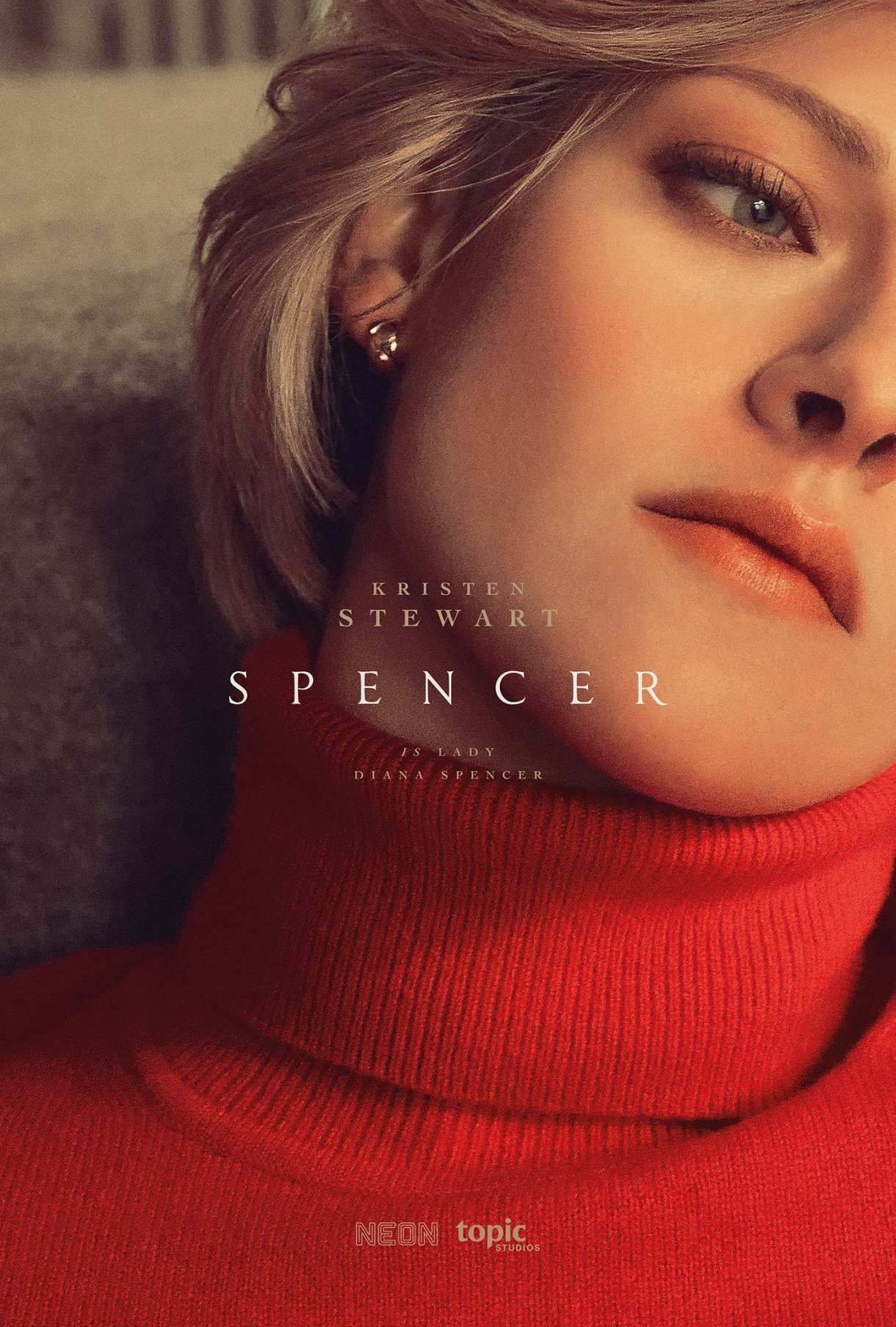 The Spencer movie cover. It features a close up of Kristen Stewart looking distant, dressed as Princess Diana.
