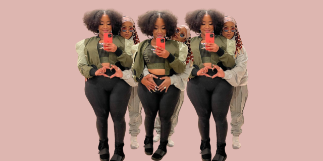 The rapper Da Brat embraces pregnant fiancé Jesseca Dupart from behind and makes a heart with her hands