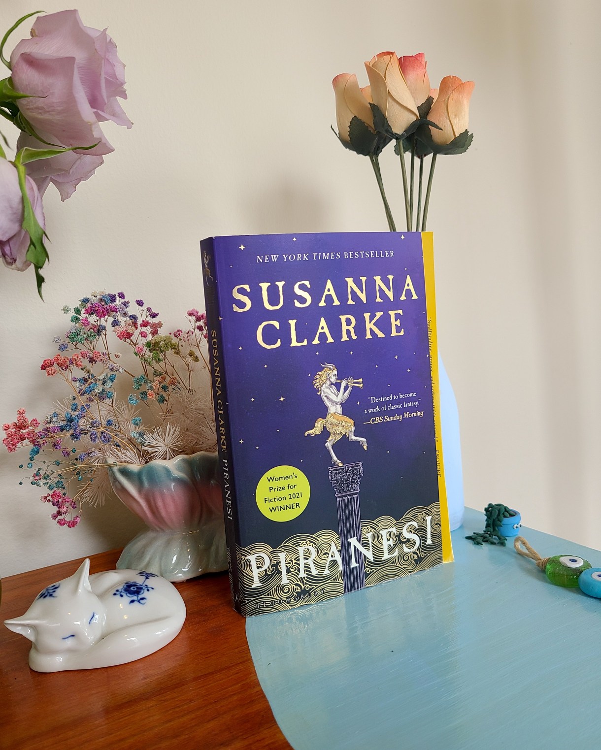This is Anya's photo of only the book she is reading, Piranesi by Susanna Clarke posted around some flowers and other decorations