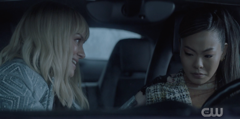 Alice and Mary in a car; Alice leaning over to talk to Mary