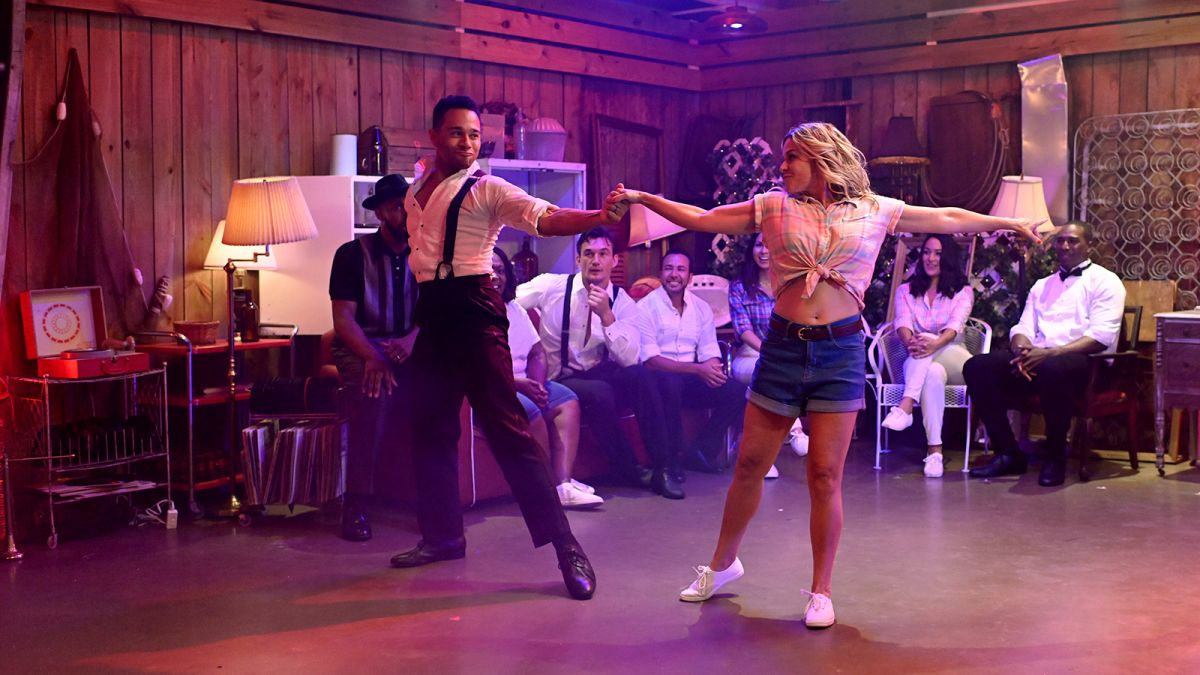 Corbin Bleu and Cat Cora in jean shorts and a tied-up button-up shirt dance in the new Fox series 'The Real Dirty Dancing'