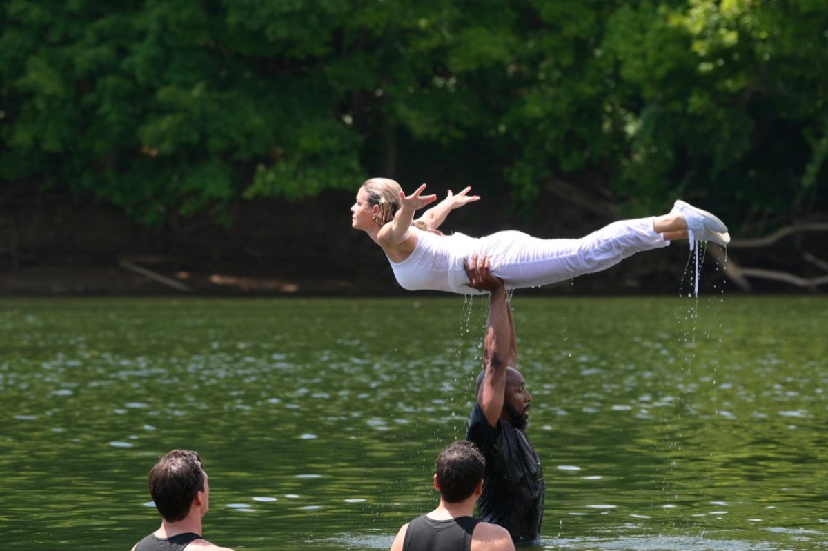 Cat Cora in all white being lifted up over Corbin Bleu's head like Baby in Dirty Dancing