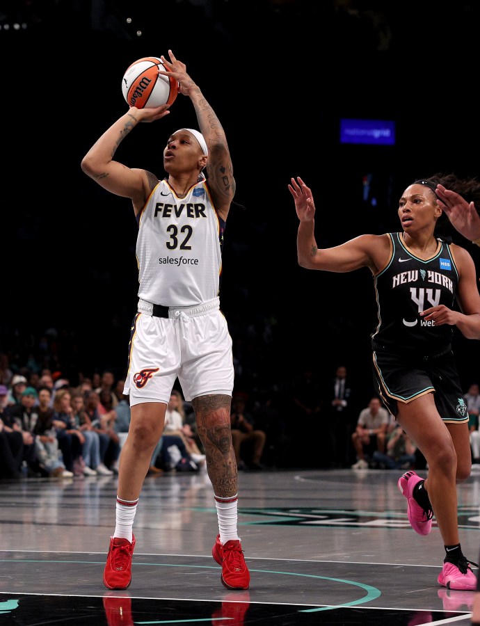 NEW YORK, NEW YORK - MAY 21: Emma Cannon #32 of the Indiana Fever takes a shot as Betnijah Laney #44 of the New York Liberty defends in the first half at Barclays Center on May 21, 2023 in the Brooklyn borough of New York City. NOTE TO USER: User expressly acknowledges and agrees that, by downloading and or using this photograph, User is consenting to the terms and conditions of the Getty Images License Agreement. (Photo by Elsa/Getty Images)