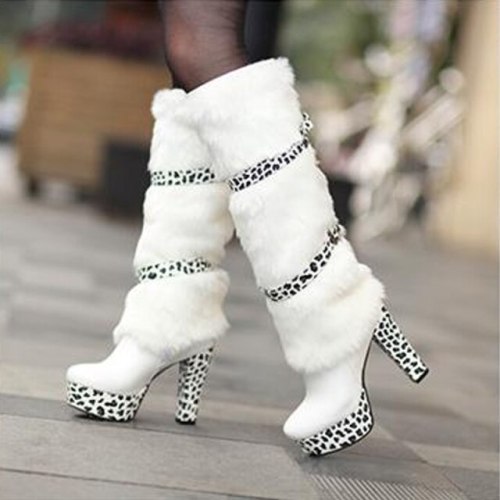 a pair of furry leopard print high heeled boots