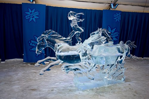 an ice sculpture of a girl stood atop a horse