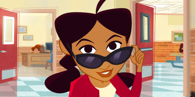 Penny Proud with her trademark sunglasses and red sweater