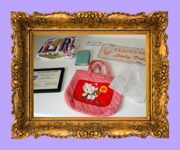 a photo of heather's various keepsakes, with the hello kitty bag most visible in the center, within a golden frame. There is also the letter, the bible, the basketball tee, the certificate, and the license plate, all visible