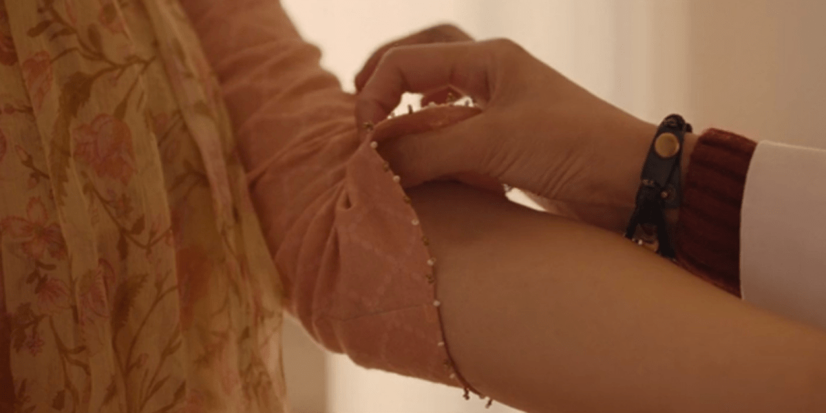 Badhaai Do review: In this still from Badhaai Do, there's a close up tender and sensual shot of someone lifting a sleeve to expose more forearm.
