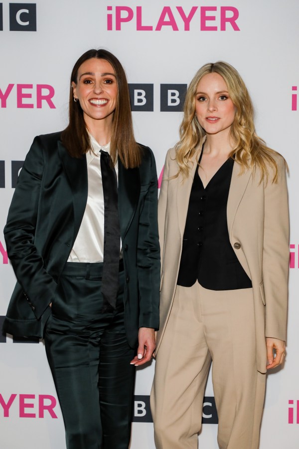 Suranne Jones in a black suit and Sophie Rundle in a tan suit on the red carpet at the Gentleman Jack season 2 premiere 