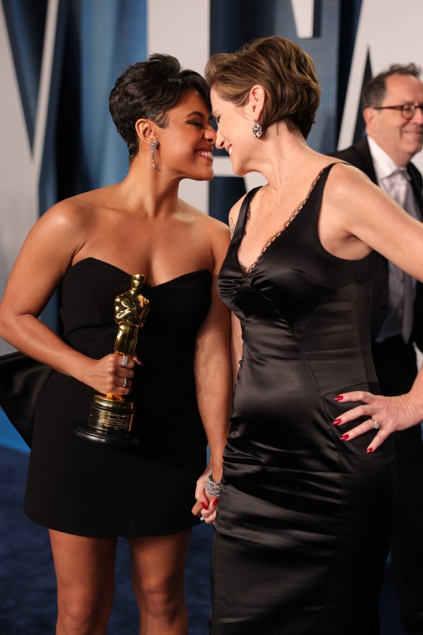 Ariana DeBose and Sue Makkoo press their noses together on the red carpet 