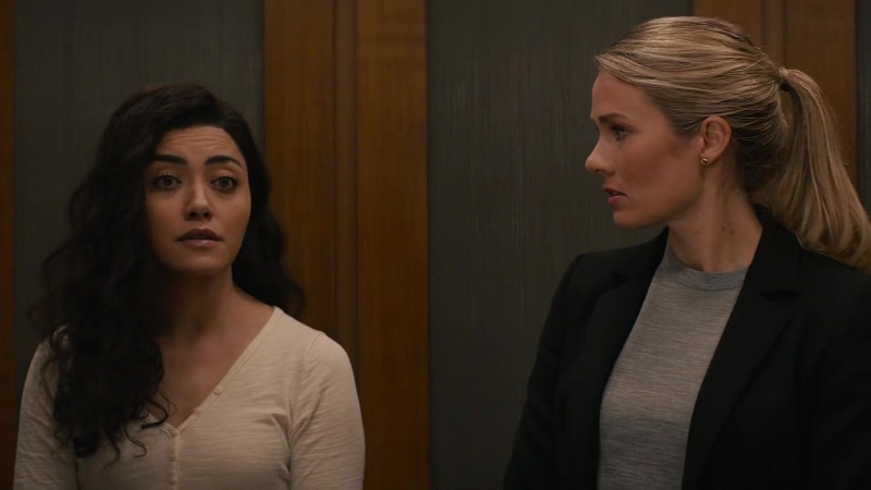 Kate looks at Lucy as she processes her feelings about Ernie's suspected kidnapping. They're riding up to NCIS HQ in an elevator. 