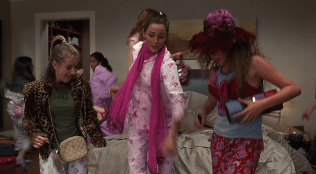 Jenna and a bunch of young girls are in pajamas dancing in a bedroom