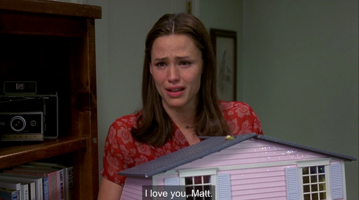 Jenna holds her dollhouse and cries while saying "I love you, Matt"