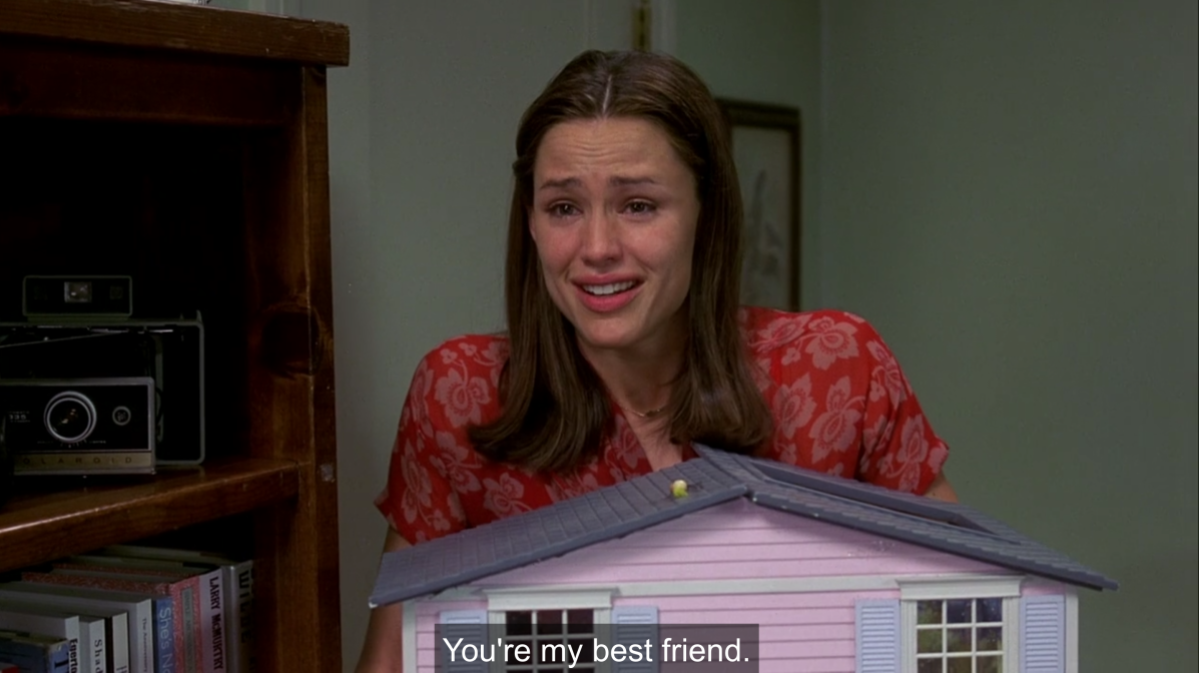 Jenna holds her dollhouse and cries while saying "you're my best friend"