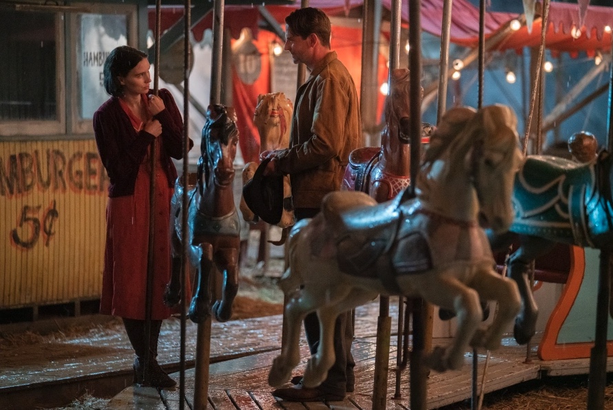 Screenshot of Rooney Mara and Bradley Cooper at the merry-go-round from Nightmare Alley