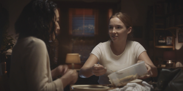 Villanelle (Jodie Comer) is serving Eve some shepherd's pie out of a tupperware