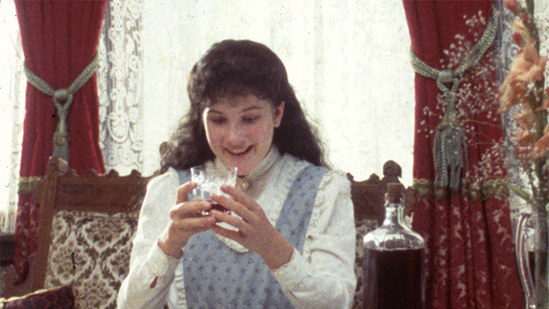 Diana looks at raspberry cordial with glee