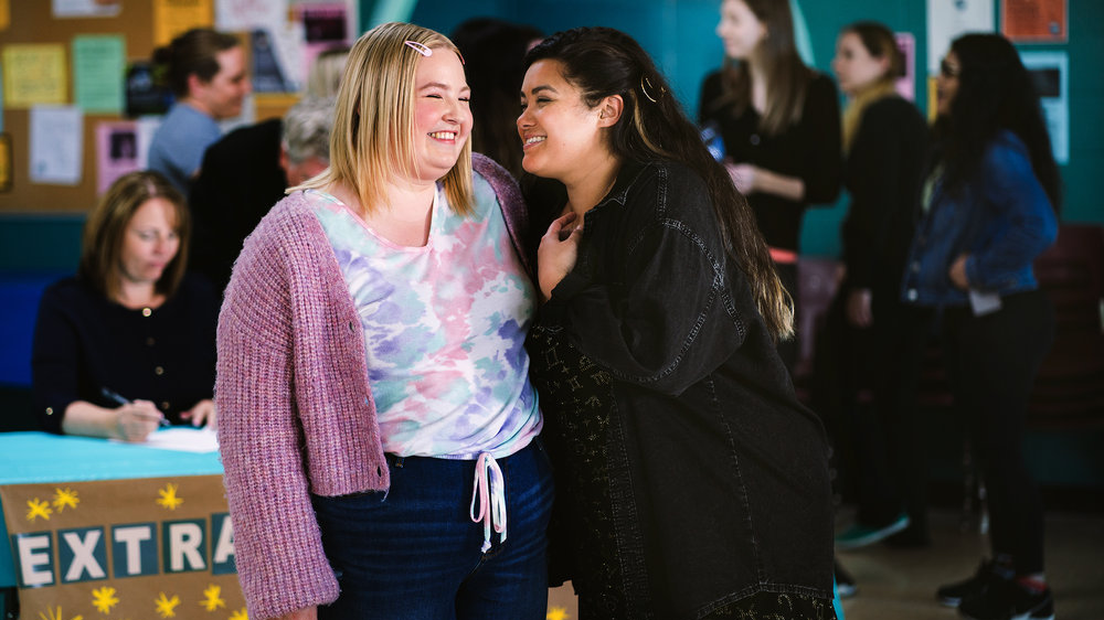 Press photo of Astrid and Lilly smiling and laughing together