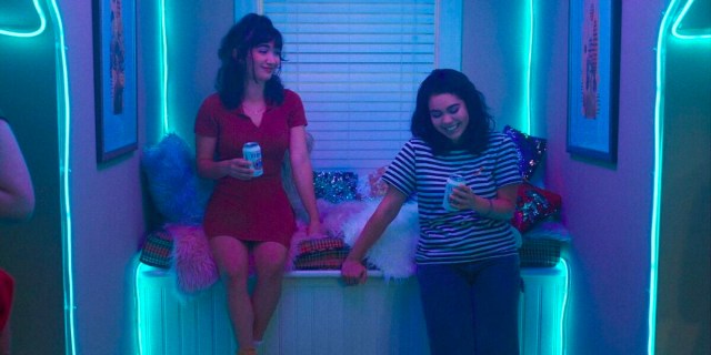 A still from Hulu's crush: two girls share a beer and a smile