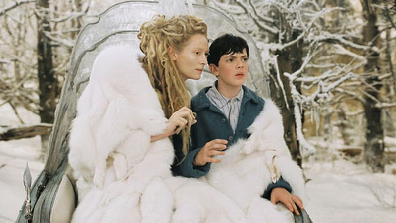 The White Witch wraps her cloak around Edmund