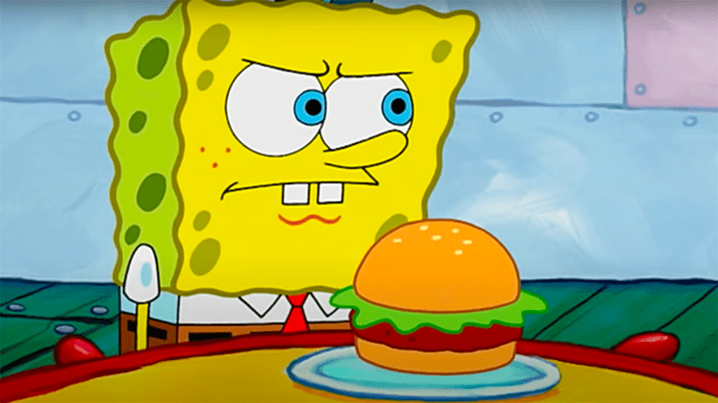 SpongeBob stands guard over a Krabby Patty